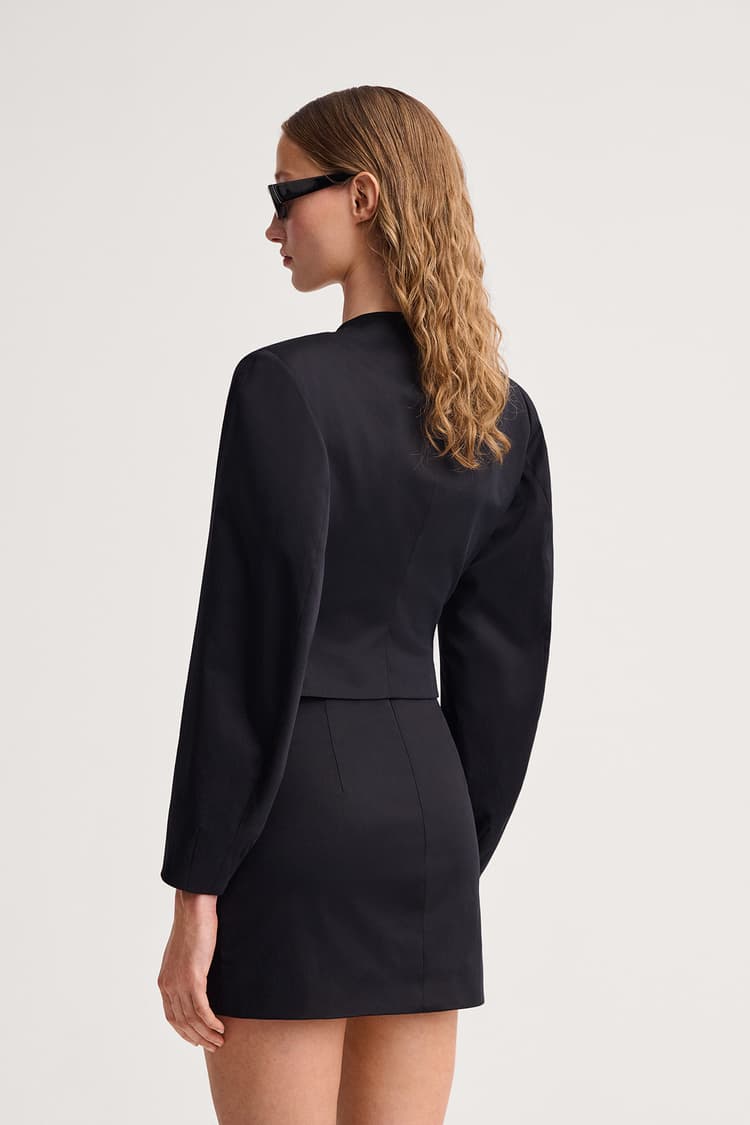 https://a.storyblok.com/f/199965/1200x1800/09162fedd7/brera-skirt-black.jpg